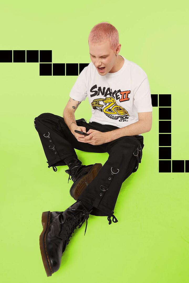 Image of a model wearing Tops. Productname: Snake Champion in White colour by brand - Pulp Kitchen