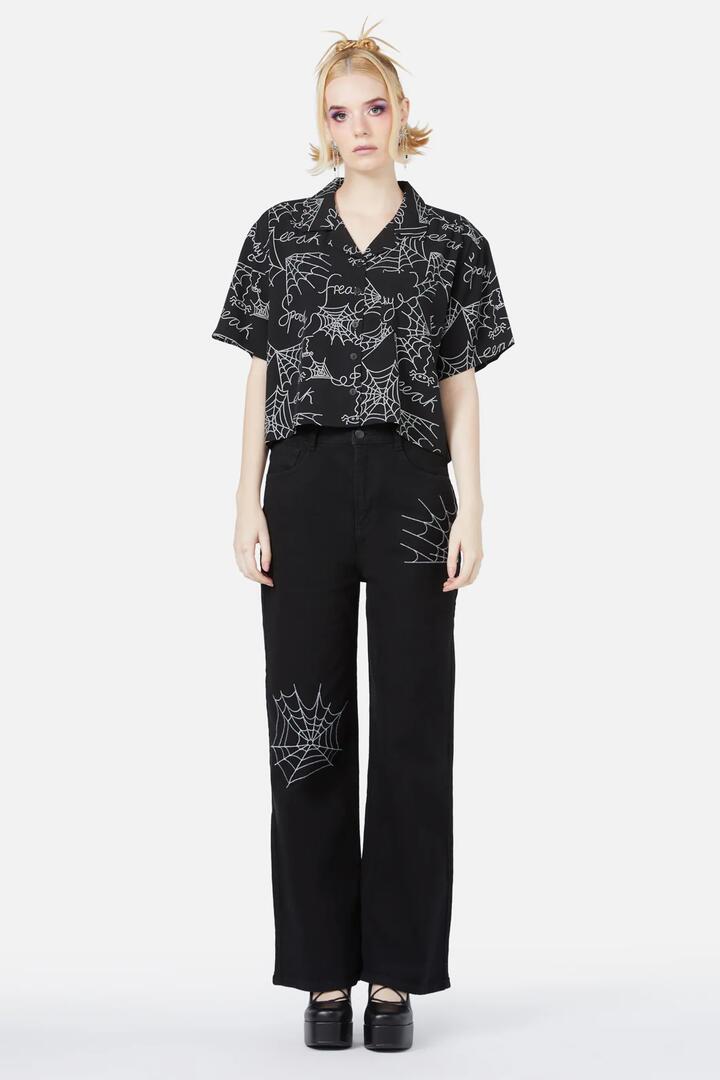Image of a model wearing Tops. Productname: Entangled Printed Blouse in Black colour by brand - Black Friday