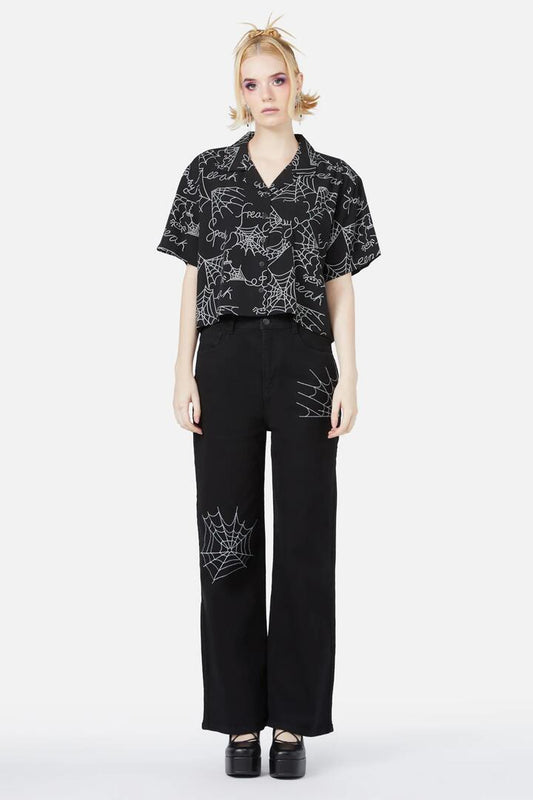 Image of a model wearing Tops. Productname: Entangled Printed Blouse in Black colour by brand - Black Friday