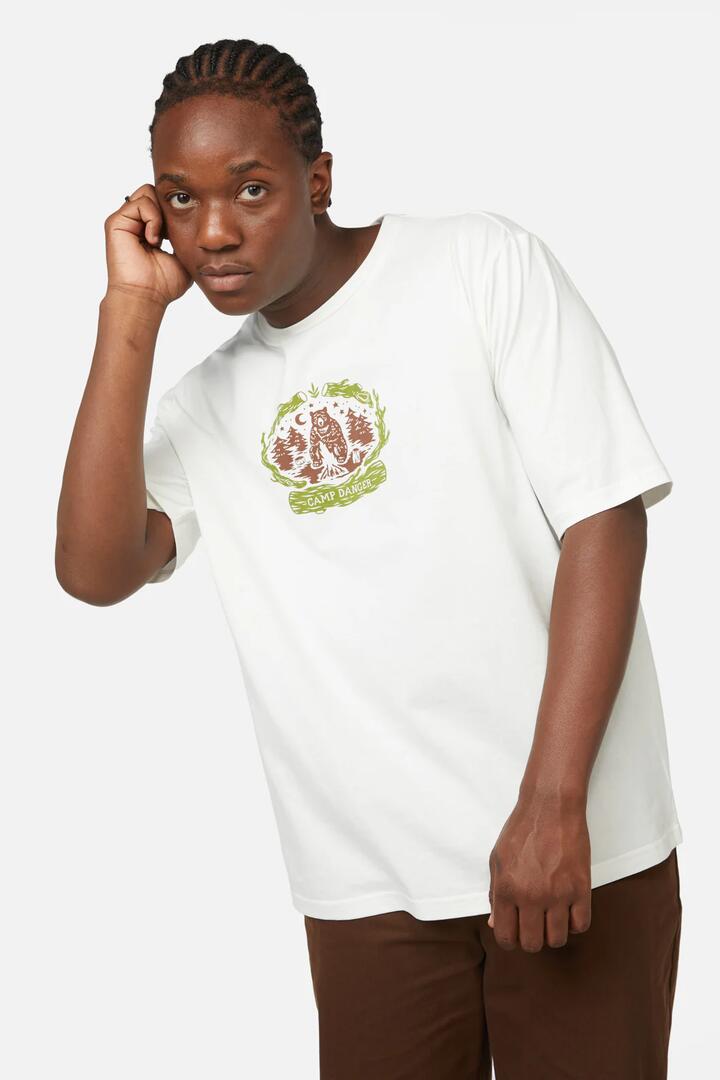Image of a model wearing Tops. Productname: Camp Danger Unisex Tee in Cream colour by brand - Dangerfield