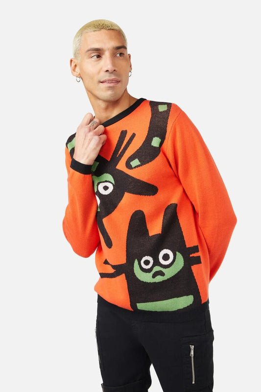 Image of a model wearing Tops. Productname: Peculiar Puss Knit in Orange colour by brand - Dangerfield