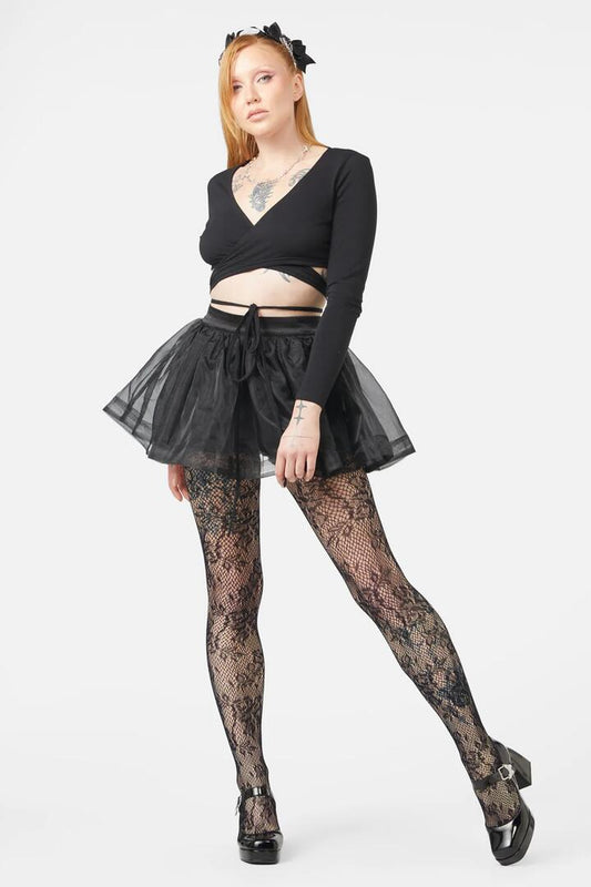Image of a model wearing Tops. Productname: Slumber Party Wrap Top in Black colour by brand - Dangerfield