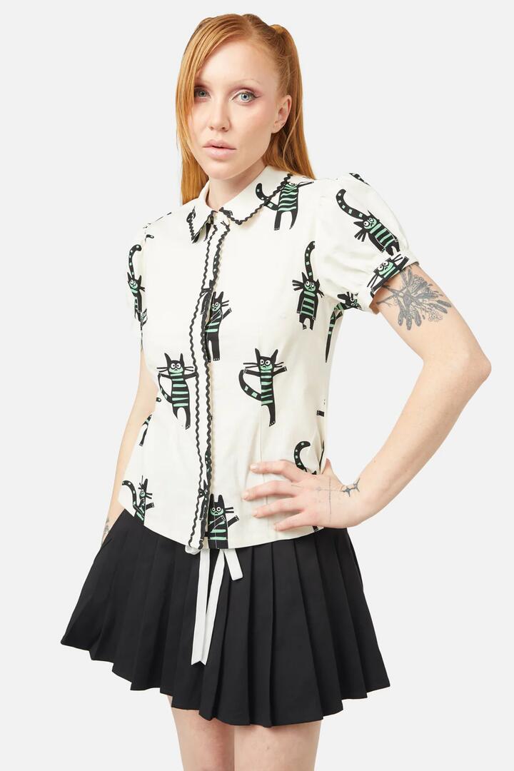 Image of a model wearing Tops. Productname: Peculiar Puss Blouse in Cream colour by brand - Dangerfield