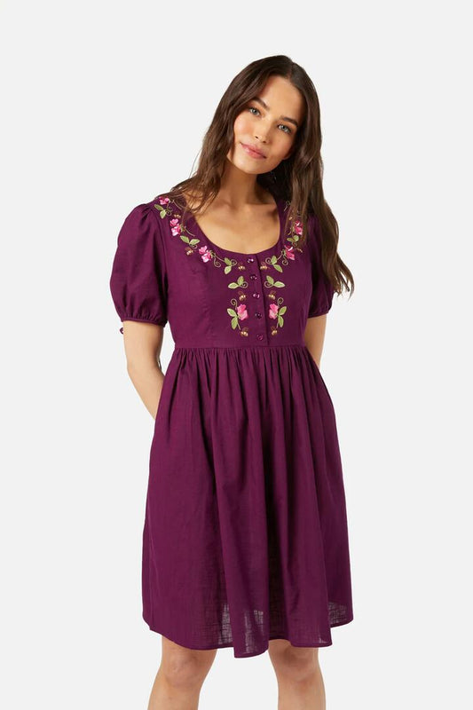 Image of a model wearing Dress. Productname: Sweetie Emb Dress in Plum colour by brand - Princess Highway