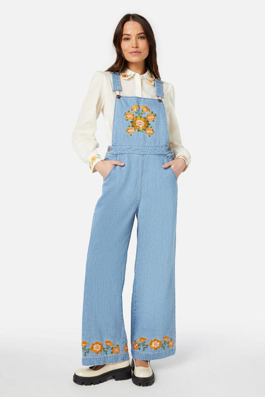 Image of a model wearing Pants. Productname: Folk Embroidered Overall in Light Denim colour by brand - Princess Highway
