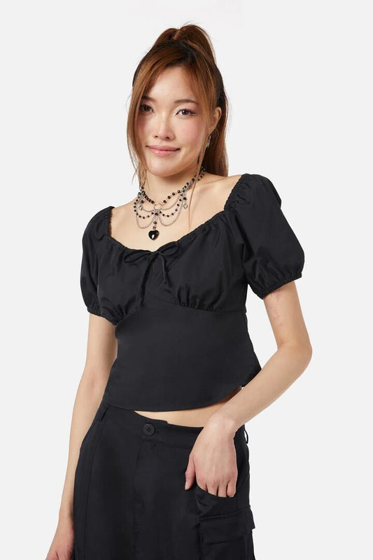 Image of a model wearing Tops. Productname: Doe Bow Top in Black colour by brand - Dangerfield