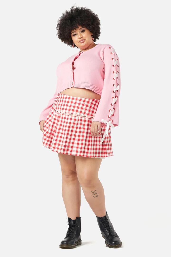 Image of a model wearing Outerwear. Productname: Curve Candy Lace Up Cardi in Pink colour by brand - Dangerfield