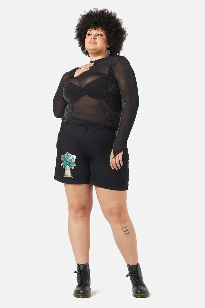 Image of a model wearing Tops. Productname: Curve Magic Top in Black colour by brand - Black Friday