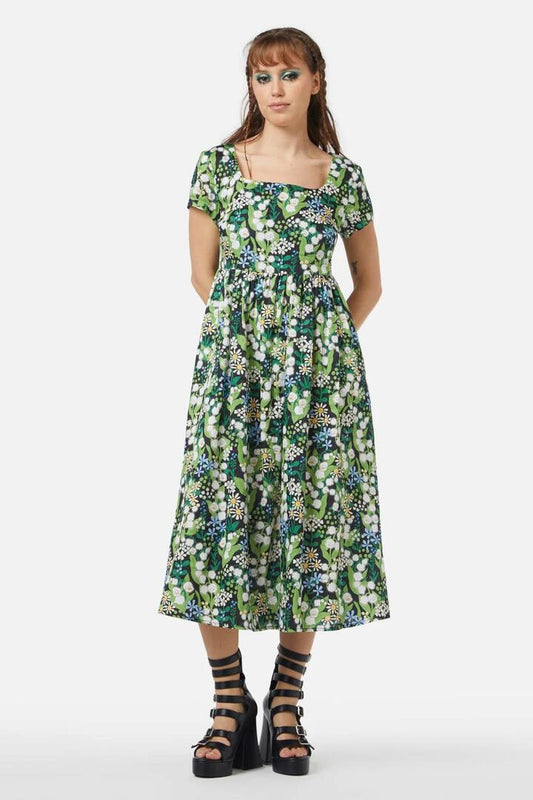 Image of a model wearing Dress. Productname: Lily Of The Valley Dress in Emerald colour by brand - Black Friday