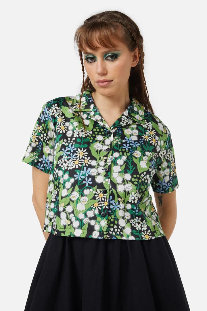 Image of a model wearing Tops. Productname: Lily Of The Valley Blouse in Emerald colour by brand - Black Friday