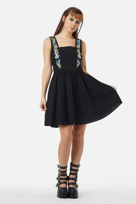 Image of a model wearing Dress. Productname: Lily Pinafore in Black colour by brand - Black Friday
