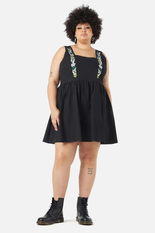 Image of a model wearing Dress. Productname: Curve Lily Pinafore in Black colour by brand - Black Friday