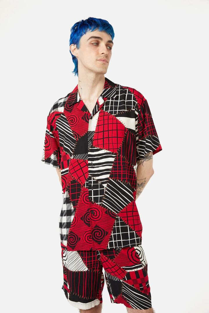 Image of a model wearing Tops. Productname: Patched Up SS Shirt in Black colour by brand - Black Friday