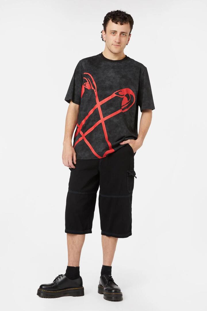 Image of a model wearing Tops. Productname: Pinned Tee in Black colour by brand - Black Friday