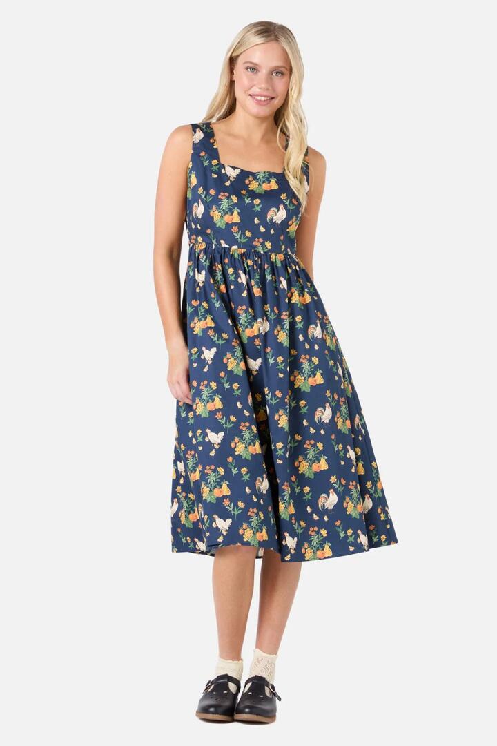 Image of a model wearing Dress. Productname: Chickens Midi Dress in Navy colour by brand - Princess Highway
