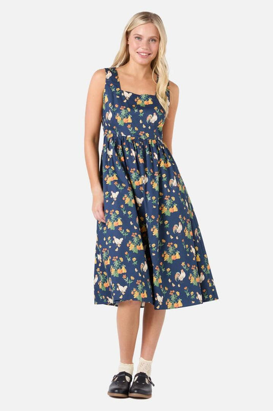 Image of a model wearing Dress. Productname: Chickens Midi Dress in Navy colour by brand - Princess Highway