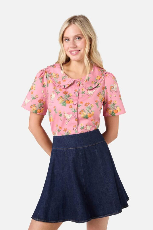 Image of a model wearing Shorts. Productname: Chickens Short Sleeve Blouse in Pink colour by brand - Princess Highway