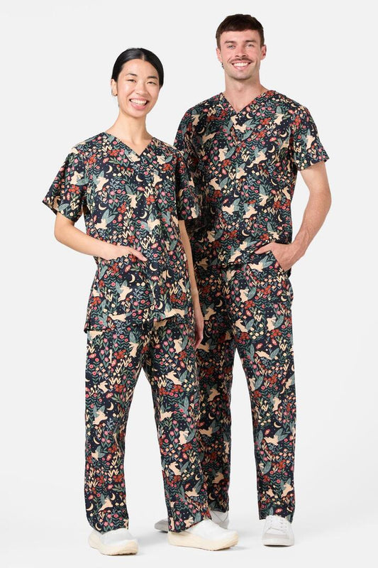 Image of a model wearing Uniforms & Workwear. Productname: Belle Bunny Scrub Set in Navy colour by brand - Princess Highway