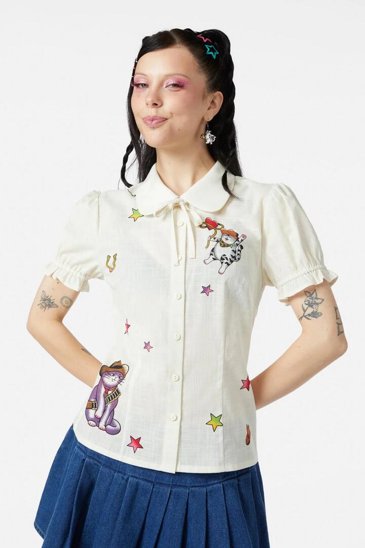 Image of a model wearing Tops. Productname: Meowdy Badge Blouse in Cream colour by brand - Dangerfield