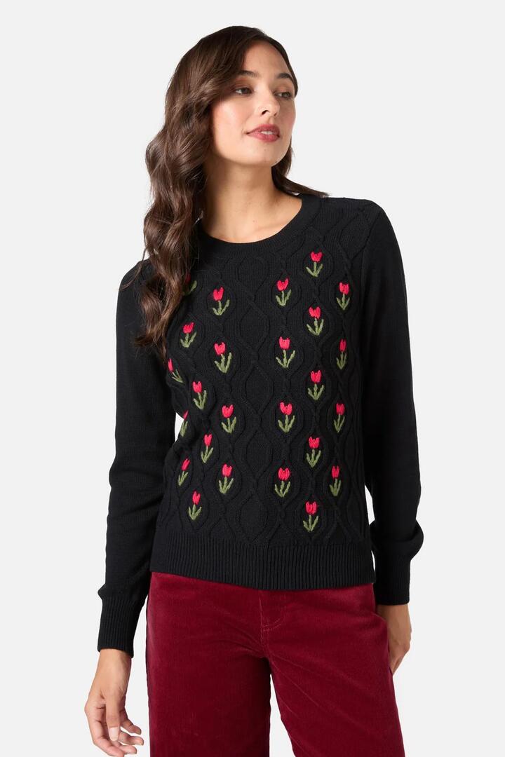 Image of a model wearing Outerwear. Productname: Tulip Embroiderd Jumper in Black colour by brand - Princess Highway