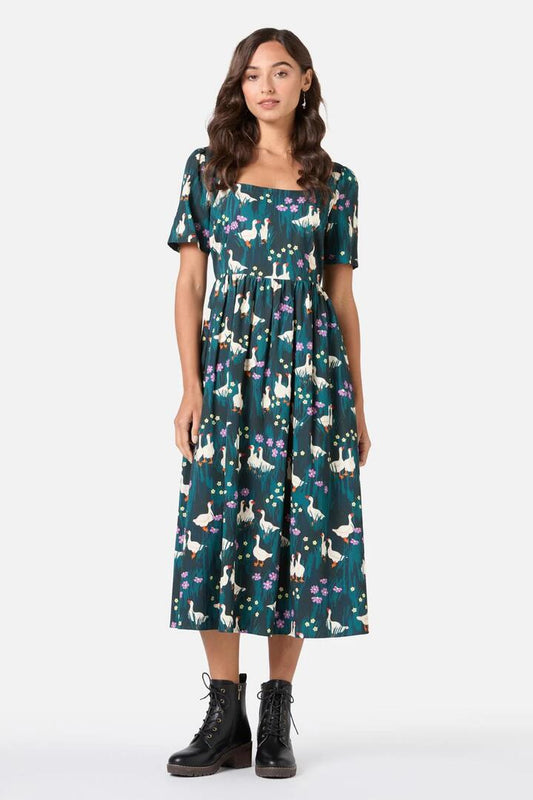Image of a model wearing Dress. Productname: Lucy Goosey Midi Dress in Midnight colour by brand - Princess Highway