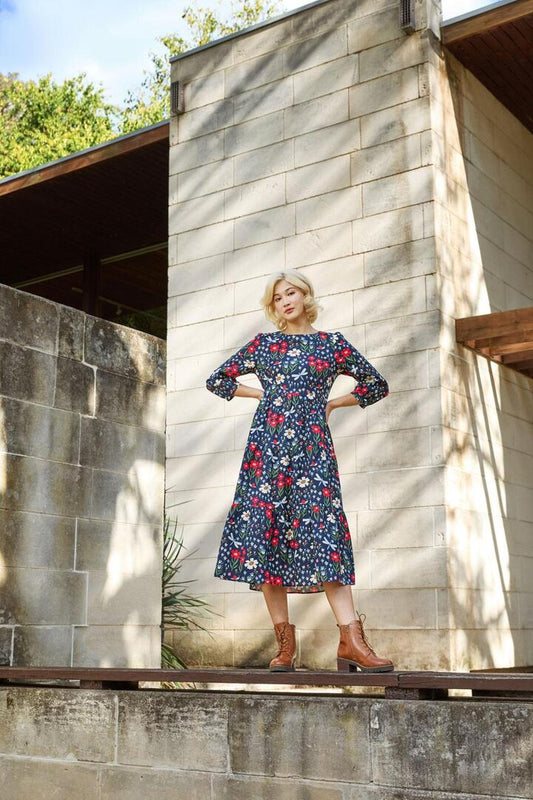 Image of a model wearing Dress. Productname: Garden Life Midi Dress in Navy colour by brand - Princess Highway