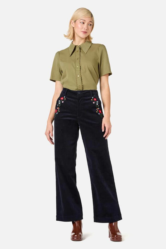 Image of a model wearing Denim. Productname: Garden Embroiderd Cord Jean in Navy colour by brand - Princess Highway