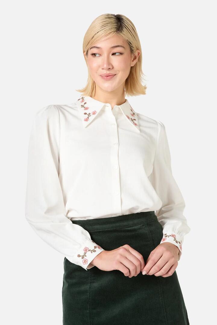 Image of a model wearing Tops. Productname: Esmerelda Embroidered Blouse in Cream colour by brand - Princess Highway