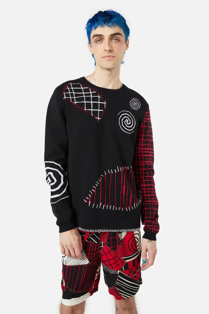 Image of a model wearing Tops. Productname: Patched Up Knit in Black colour by brand - Black Friday