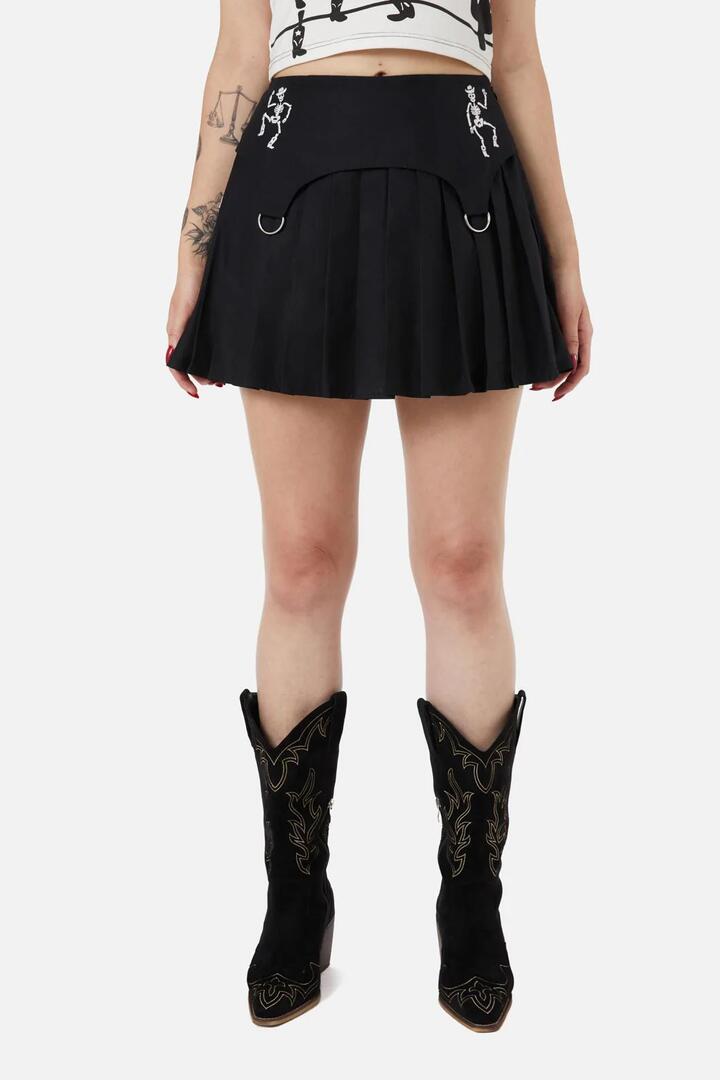 Image of a model wearing Skirts. Productname: Skelly Yoke Skort in Black colour by brand - Black Friday
