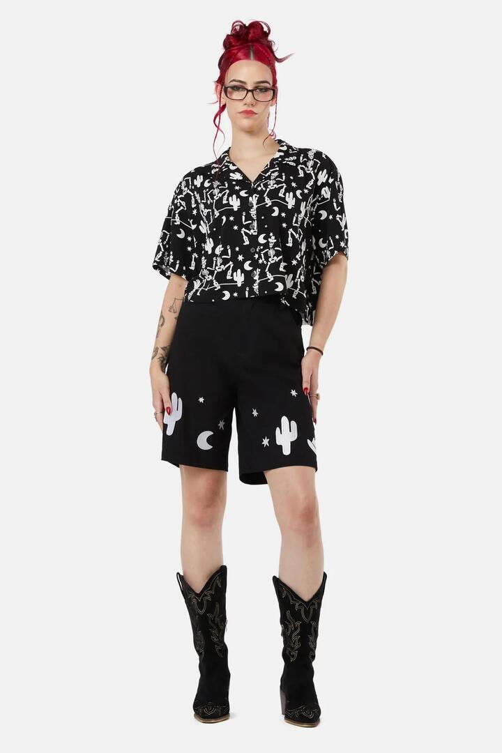 Image of a model wearing Tops. Productname: Boothill Blouse in Black colour by brand - Black Friday