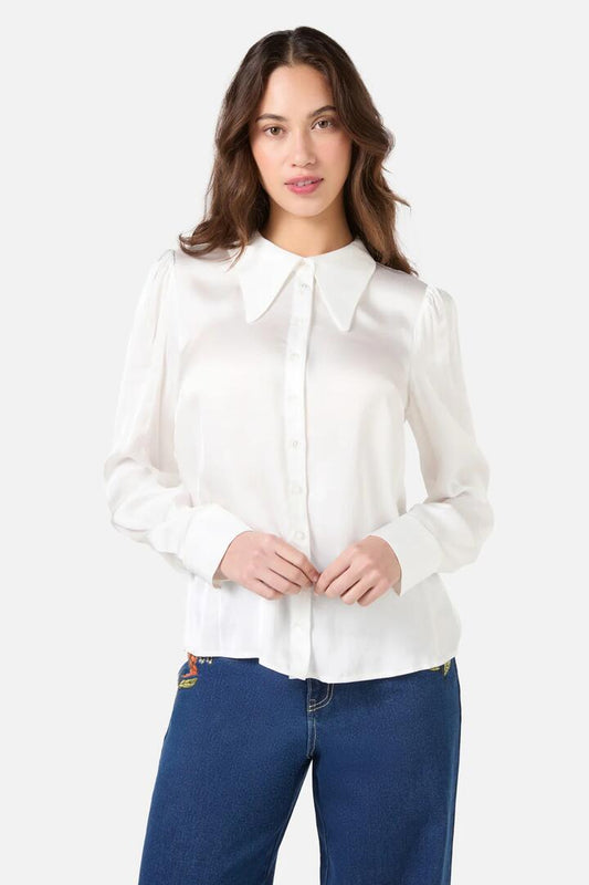 Image of a model wearing Tops. Productname: Jane Pointed Collar Shirt in Cream colour by brand - Princess Highway