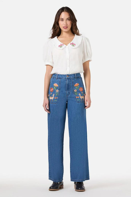 Image of a model wearing Denim. Productname: Llama Embroidered Denim Jean in Blue Denim colour by brand - Princess Highway