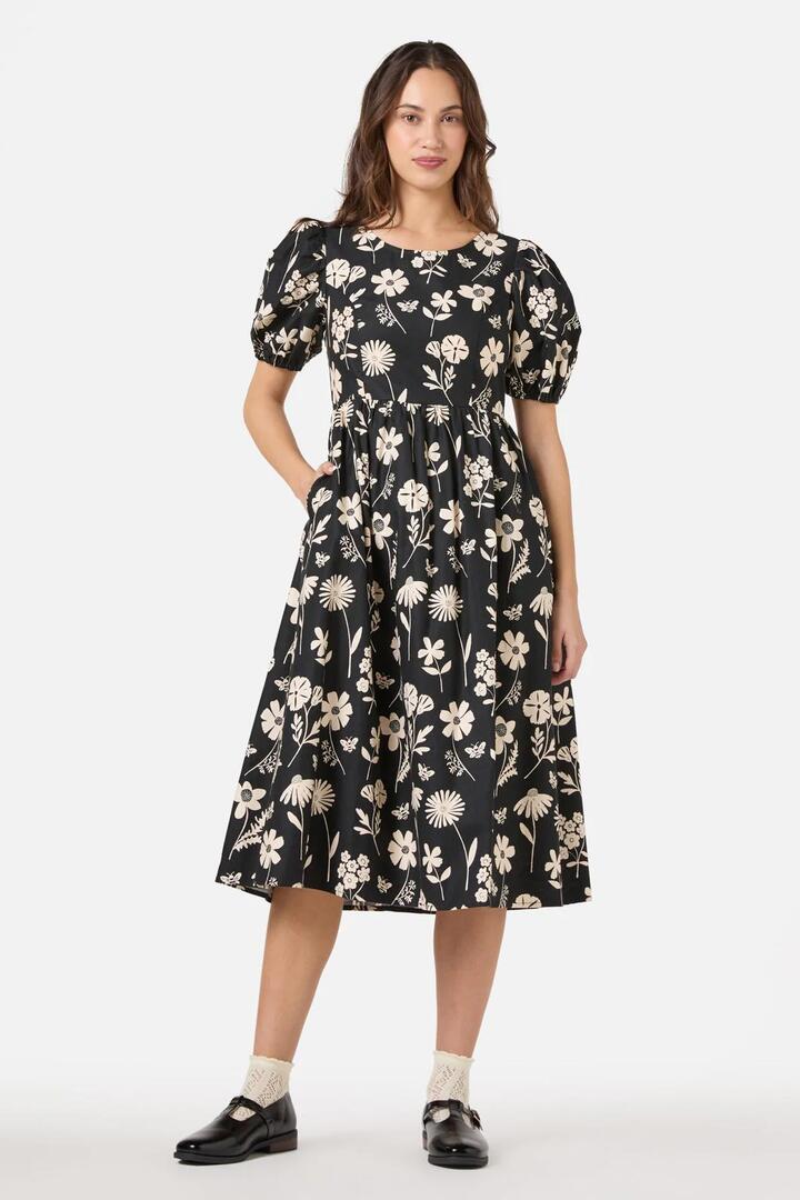 Image of a model wearing Dress. Productname: Variety Fleur Midi Dress in Black colour by brand - Princess Highway