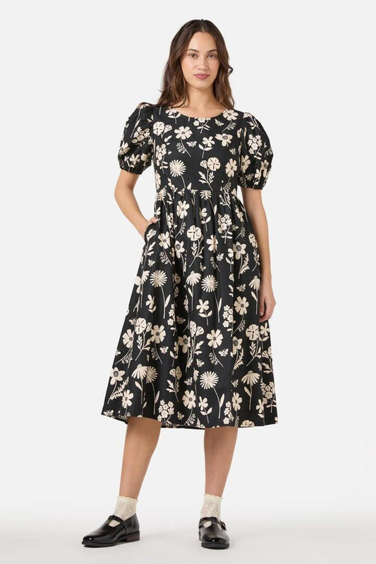 Image of a model wearing Dress. Productname: Variety Fleur Midi Dress in Black colour by brand - Princess Highway