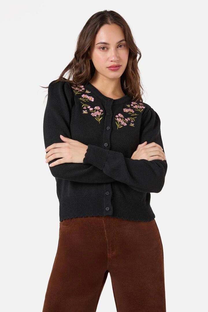 Image of a model wearing Outerwear. Productname: Flora Bee Embroidered Cardigan in Black colour by brand - Princess Highway