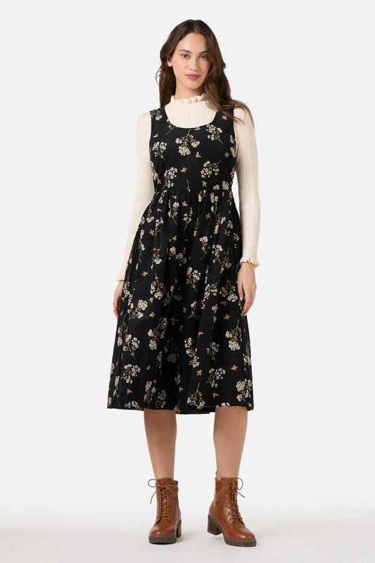 Image of a model wearing Dress. Productname: Flora Bee Cord Midi Dress in Black colour by brand - Princess Highway