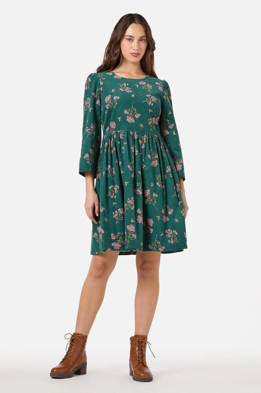 Image of a model wearing Dress. Productname: Flora Bee Cord Smock Dress in Green colour by brand - Princess Highway