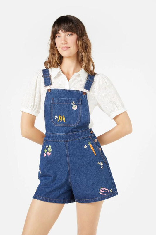 Image of a model wearing Pants. Productname: Market Day Emb Short Overall in Dark Denim colour by brand - Princess Highway