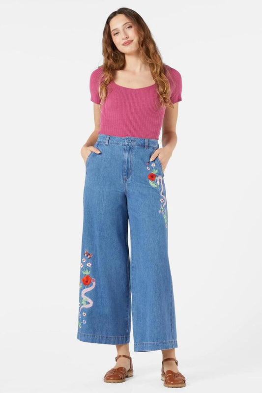 Image of a model wearing Denim. Productname: Snake Embroidered Jean in Blue Denim colour by brand - Princess Highway