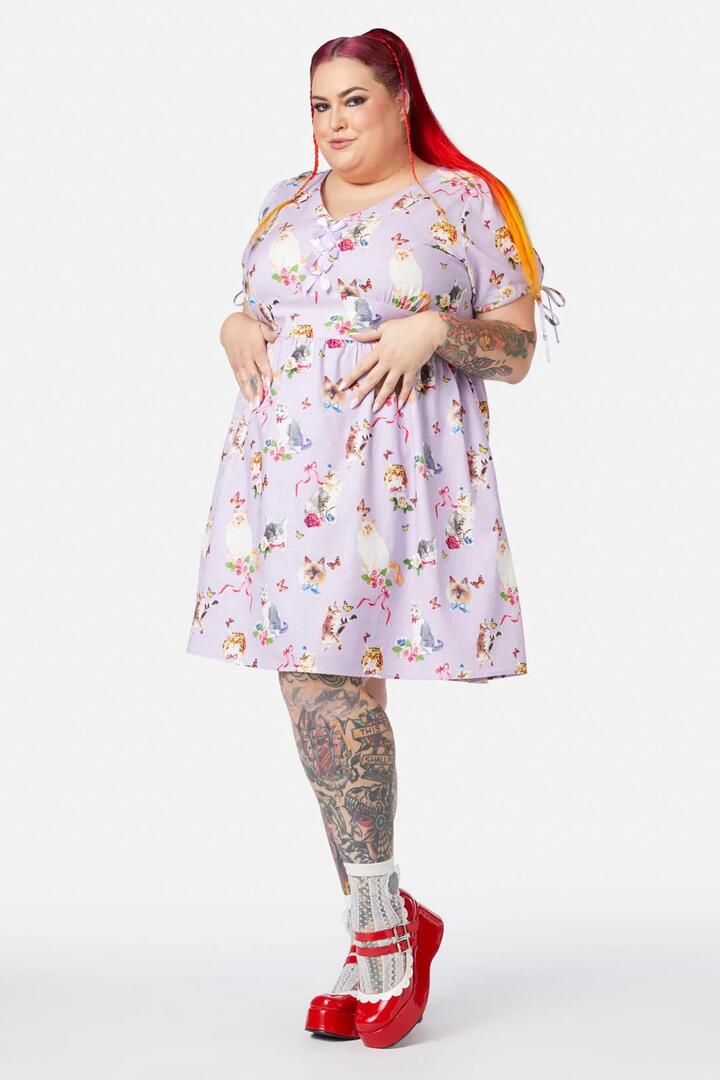 Image of a model wearing Dress. Productname: Curve Kitsch Kitty Print Dress in Purple colour by brand - Dangerfield