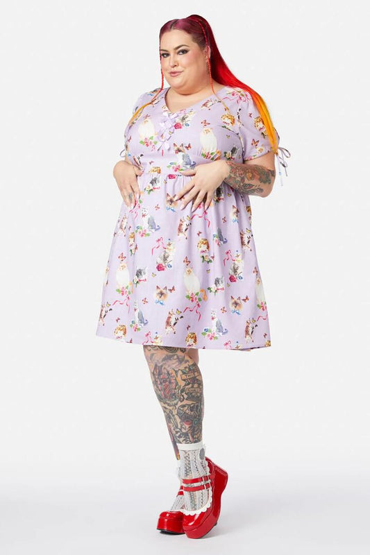 Image of a model wearing Dress. Productname: Curve Kitsch Kitty Print Dress in Purple colour by brand - Dangerfield