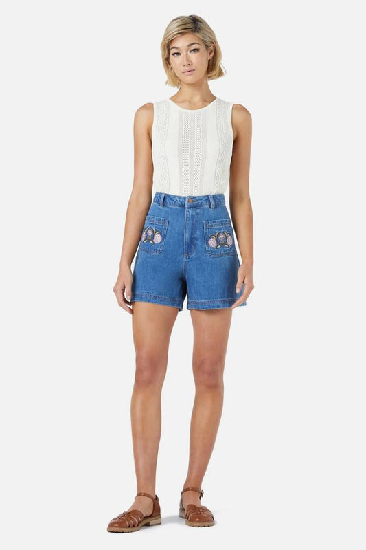 Image of a model wearing Shorts. Product name - Renata Embroidered Short in Mid Denim colour by brand - Princess Highway