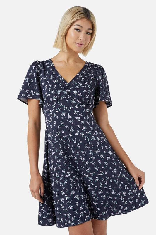 Image of a model wearing Dress. Productname: Lila Ditsy Mini Dress in Navy colour by brand - Princess Highway