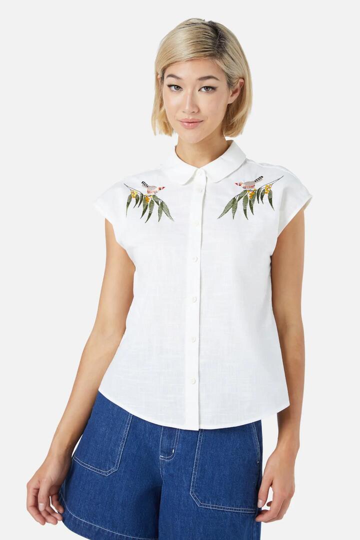 Image of a model wearing Tops. Productname: Finch Emb Blouse in Cream colour by brand - Princess Highway