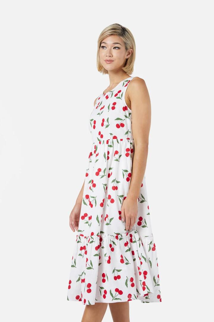 Image of a model wearing Dress. Productname: Cherry Girl Midi Dress in Cream colour by brand - Princess Highway