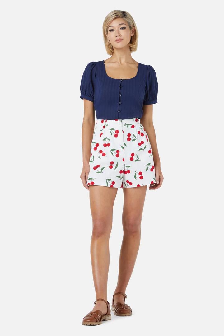 Image of a model wearing Skirts. Productname: Cherry Girl Skort in Cream colour by brand - Princess Highway