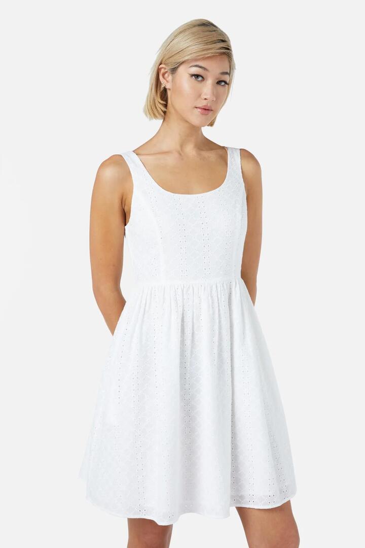 Image of a model wearing Dress. Productname: Trinity Mini Dress in White colour by brand - Princess Highway