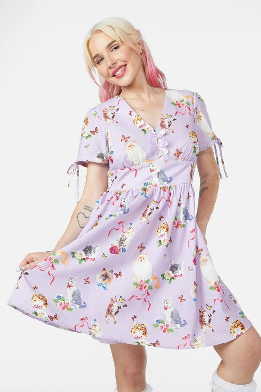 Image of a model wearing Dress. Productname: Kitsch Kitty Print Dress in Cream colour by brand - Dangerfield
