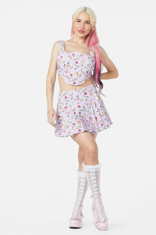 Image of a model wearing Skirts. Productname: Kitsch Kitty Print Skort in Purple colour by brand - Dangerfield